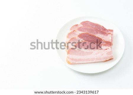 Sliced bacon on white background.