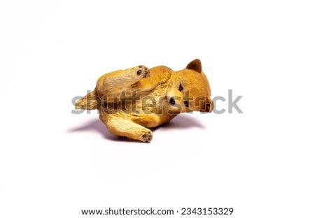 brown dog toy on white background