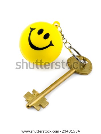 Golden key on key ring smiles isolated on white background