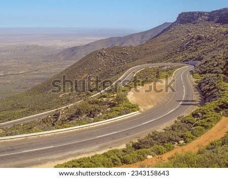 Van Rhyn's Pass straddles the border of the Western and Northern Cape provinces of South Africa and connects Vanrhynsdorp with Nieuwoudtville. It was originally built and designed by Thomas Bain. Royalty-Free Stock Photo #2343158643