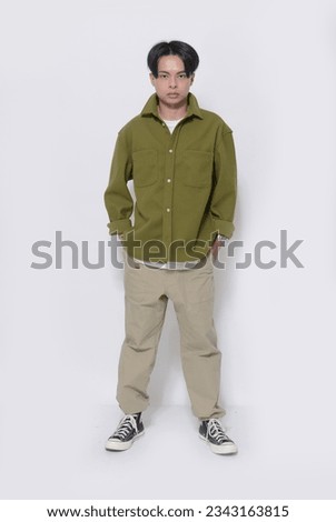 Full body Portrait of 
 Handsome Young Man, student Posing Over White Background
