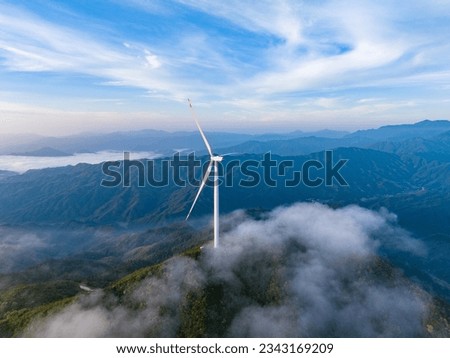 Sea of clouds and wind power on the mountain in the morning Royalty-Free Stock Photo #2343169209