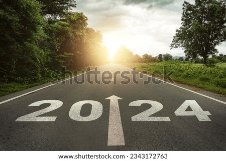 New year 2024 or straightforward concept. Text 2024 written on the road in the middle of asphalt road at sunset.Concept of planning and challenge, business strategy, opportunity ,hope, new life change Royalty-Free Stock Photo #2343172763
