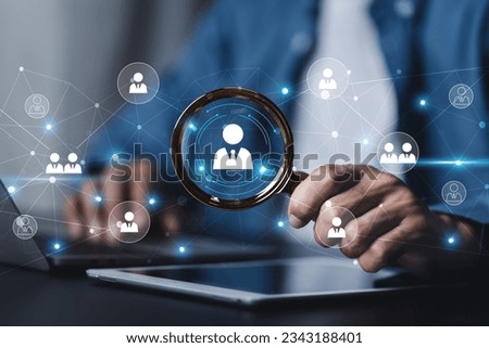 Businessman showing virtual graphic human icon HR human resources recruitment team Staff management business concept. Royalty-Free Stock Photo #2343188401