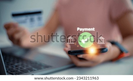 Women use hold credit cards and pay via mobile banking for online shopping technology icons. Digital banking internet payment online shopping and financial technology concepts.