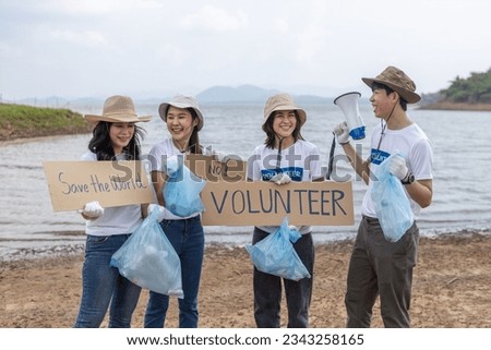 Group of volunteers holding rubbish bags. clean up plastic garbage. Conservation and care cleanliness in nature. Invitation to keep the world clean. Save the world, no plastic, no foam.