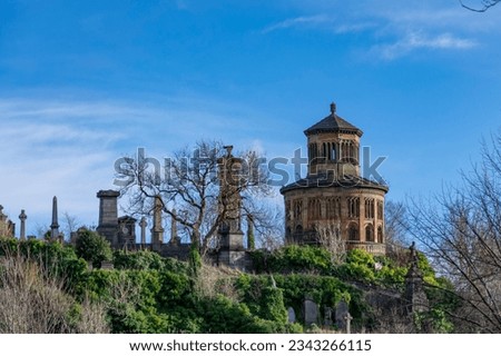 Old ancient graveyard on the hill by Glasgow Cathedral on winter sunny day with a blue sky Royalty-Free Stock Photo #2343266115
