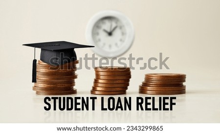 Student loan relief is shown using a text and photo of coins Royalty-Free Stock Photo #2343299865