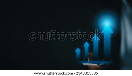 Goal and Achviement concept.,Businessman using smartphone with virtual growth arrow graph over black background with copyspace perfect for technology,business idea.