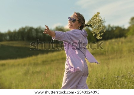Picture of an active elderly woman, symbolizing wellness and vitality in later life, a perfect example of healthy aging Royalty-Free Stock Photo #2343324395