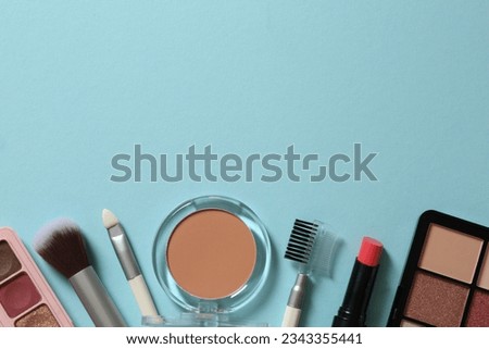 Set of decorative cosmetics on a colored background