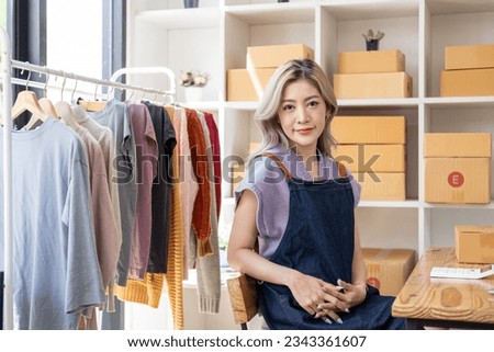 Young happy female woman lady fashion blogger business owner sale showing check clothes for present and sell in livestream live online internet shop 