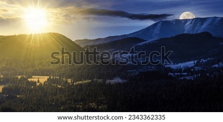 fir trees in the valley of apuseni mountain range with sun and moon at twilight. day and night time change concept. mysterious nature scenery in morning light Royalty-Free Stock Photo #2343362335