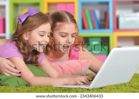 woman and girls using laptop. High quality photo
