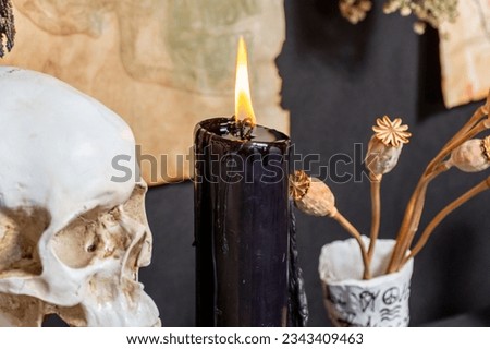 Black magic candles witchcraft composition. Magic ritual satanic tools and items. Halloween and occult black magic ritual imaginary. Ritual scene in dark and frightening atmosphere.