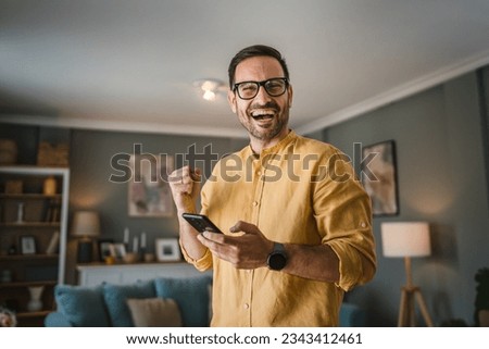 One man adult caucasian male with beard and eyeglasses stand at home happy smile copy space Royalty-Free Stock Photo #2343412461