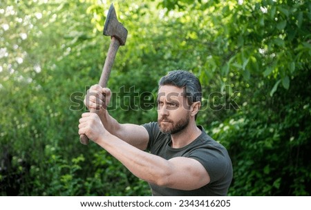 image of man hit with axe. man hit with axe. man hit with axe wearing shirt.