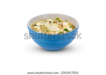 Miso soup with tofu. Picture of soup in a blue bowl. The image is fully sharp, front to back. Clipping path.