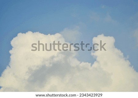 Landscape of Fluffy White Clouds under Perfect blue day sky
