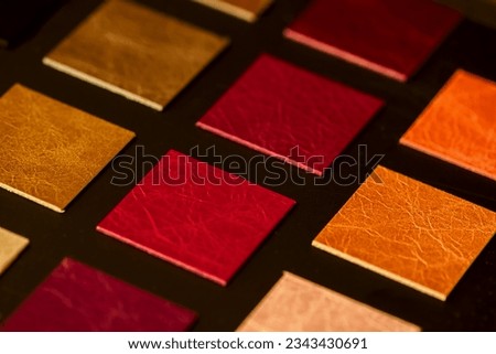 Colorful leather samples, choice of texture and color, dark background