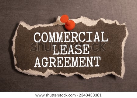 Handwriting text writing Commercial Lease. Concept meaning contract between a landlord and a business property tenants. Commercial lease text written in Notebook