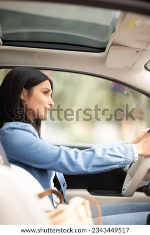Portrait beautiful young woman driving car