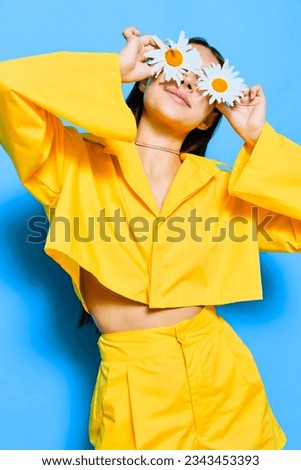 woman flower young blue model portrait happiness care chamomile yellow smile Royalty-Free Stock Photo #2343453393