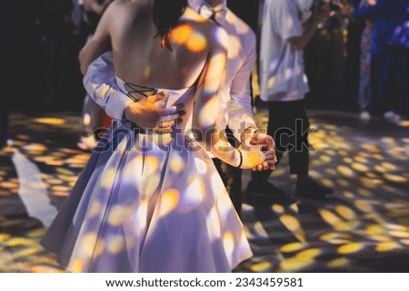 High school graduates dancing waltz and classical ball dance in dresses and suits on school prom graduation, classical ballroom dancers dancing, waltz, couples quadrille and polonaise Royalty-Free Stock Photo #2343459581