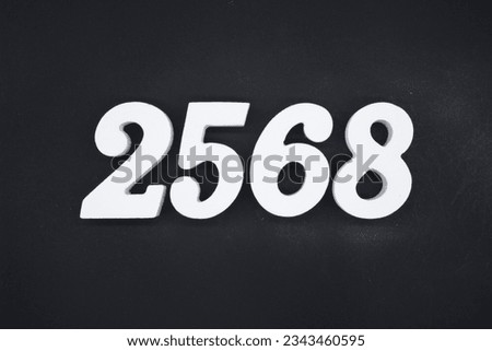 Black for the background. The number 2568 is made of white painted wood.