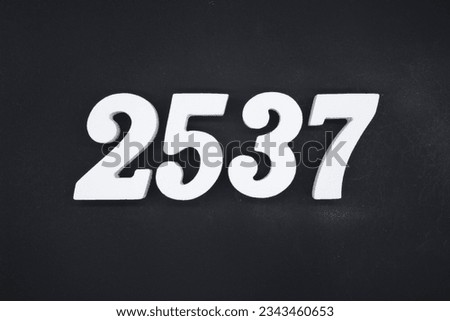 Black for the background. The number 2537 is made of white painted wood.