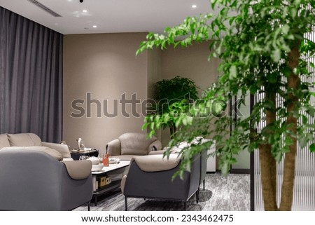 Indoor seating area with sofa and Chinese tea set Royalty-Free Stock Photo #2343462475