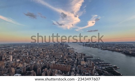 Captivating aerial view of New York City skyline over the Hudson River during the dusk seen from The Edge. Few white clouds above the city. Endless rows of tall buildings. Bustling and lively city Royalty-Free Stock Photo #2343497607