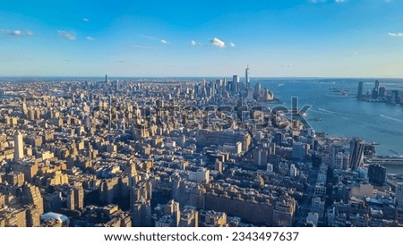 Captivating aerial view of New York City skyline over the Hudson River during the dusk seen from The Edge. Few white clouds above the city. Endless rows of tall buildings. Bustling and lively city Royalty-Free Stock Photo #2343497637