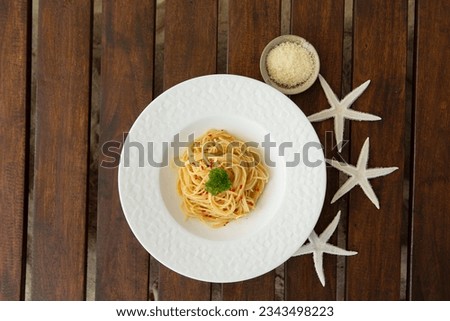 Peperoncino oil pasta on a plate Royalty-Free Stock Photo #2343498223