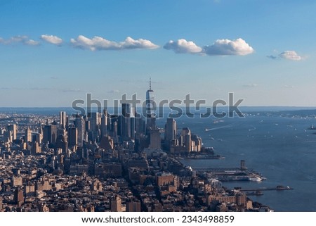 Captivating aerial view of New York City skyline over the Hudson River during the dusk seen from The Edge. Few white clouds above the city. Endless rows of tall buildings. Bustling and lively city Royalty-Free Stock Photo #2343498859