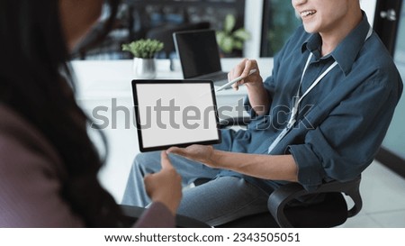 blank screen of man hand working on tablet work while sitting at the table, mockup blank screen for product display or graphic design