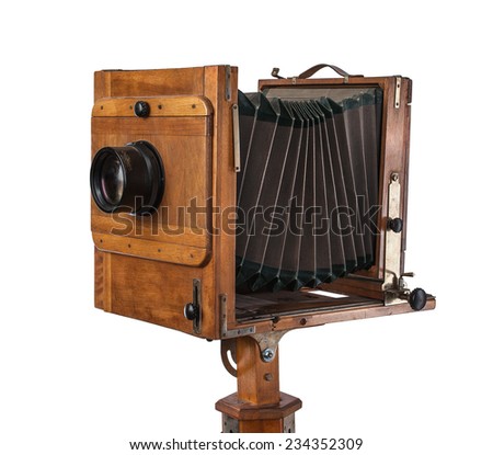Old vintage wooden view camera isolated on white