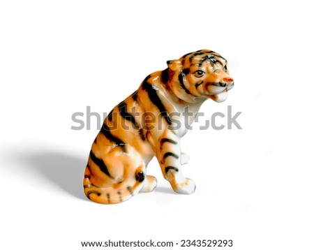 Sitting tiger animal miniature isolated on white