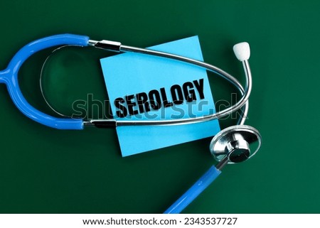 stethoscope and colored paper with the word Serology. science and medicine concepts Royalty-Free Stock Photo #2343537727