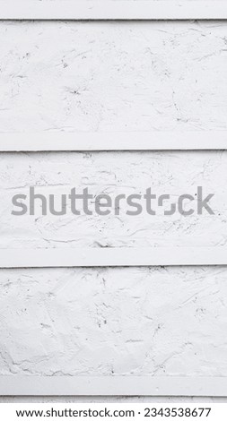 Close-up of a textured white concrete background. Ideal material for designers and photographers looking for a versatile backdrop. Perfect for creating a modern and clean aesthetic