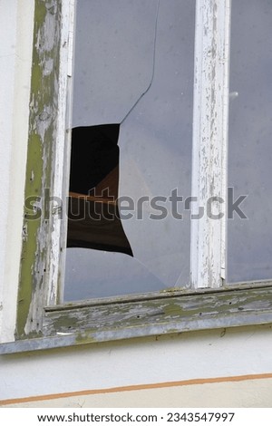 glass breakage of a glass pane or a glass panel Royalty-Free Stock Photo #2343547997