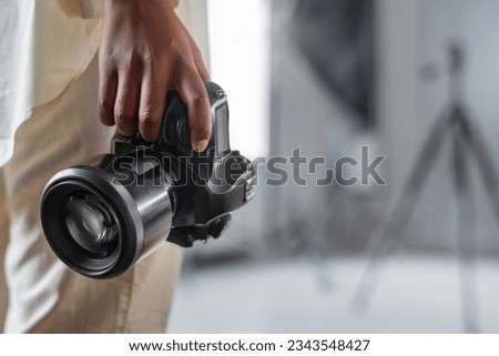 Photo Camera. professional DSLR photo camera body with lens. photography concept. photography camera. photography equipment. Professional photographer accessories background. copy space. Royalty-Free Stock Photo #2343548427