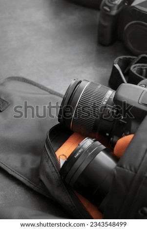 Photo Camera. professional DSLR photo camera body with lens. photography concept. photography camera. photography equipment. Professional photographer accessories background. copy space. Royalty-Free Stock Photo #2343548499