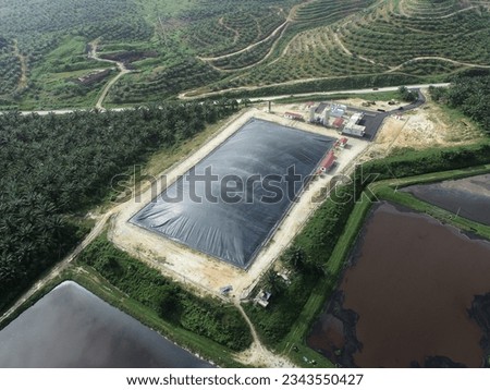 An aerial view of oil palm bio gas mill during daylight. 