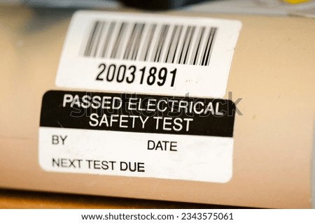 Sticker on an electrical appliance stating that it has passed a safety test Royalty-Free Stock Photo #2343575061