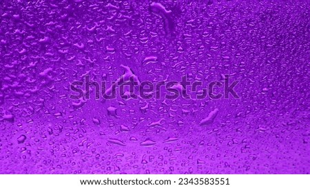 Drops of water on a colored background. Abstract texture