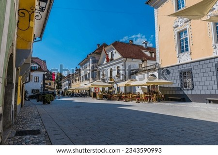 A view up the main street in the old town of Radovljica, Slovenia in summertime Royalty-Free Stock Photo #2343590993