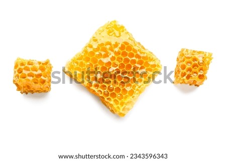 Sweet honeycombs on white background Royalty-Free Stock Photo #2343596343