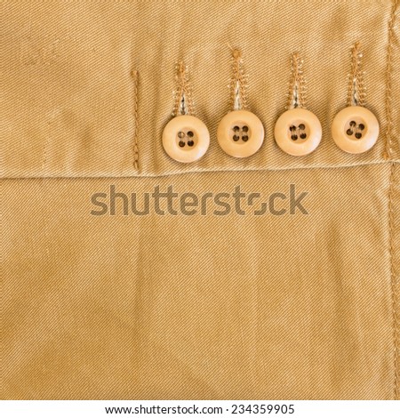 brown fabric texture with button on material of textile industrial