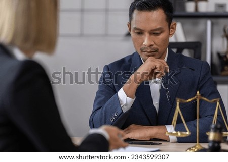 Business Asian people and lawyers, Businessman and lawyer discuss the contract document. Judge gavel deciding on marriage divorce signing papers. lawyer concept.